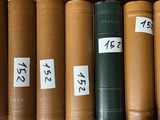 a lot of books that are sitting on a shelf