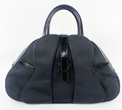 a black leather handbag on a white background