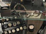 a glass display case with a lot of watches on it