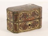 a small wooden box with a decorative design on it