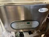 a stainless steel dishwasher that is sitting on a counter