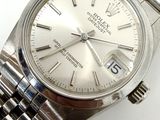 an image of a close up of a watch on a white surface