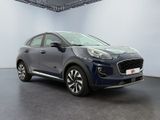 a blue car is parked in a white room with a black floor