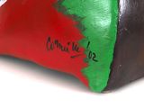 a red, green and black bag with writing on it
