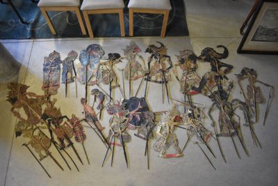many different types of paper dolls on display on the floor