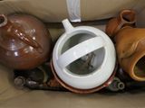 a box full of different types of vases in it