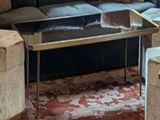 an image of a living room with a couch and a coffee table