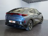 the rear end of a blue car in a showroom