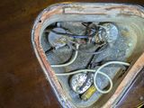 a triangle shaped box with a bunch of tools inside of it