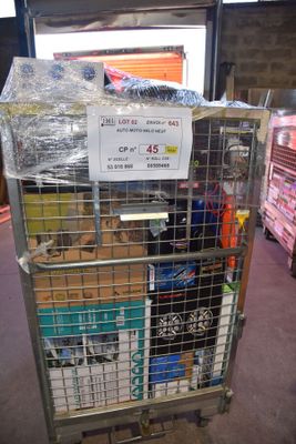 a metal cart with a sign on top of it in a warehouse