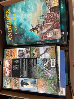 a box full of books that are sitting on top of a table