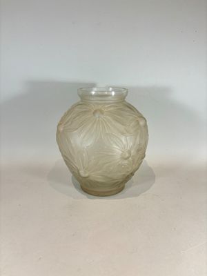 a glass vase that is sitting on a table