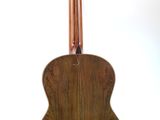 an image of a wooden guitar on a stand on a white background