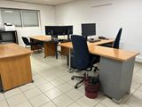 an image of an office with two desks and two monitors