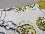 a close up of a purse with a pair of scissors on it