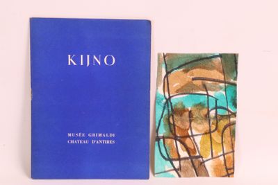 un livre bleu posé à côté d'un tableau sur une surface blanche