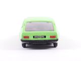 a green toy car that is sitting on a white surface