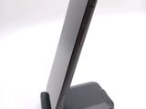 a close up of a cell phone on a stand