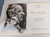 an open book with a drawing of a man ' s face on it