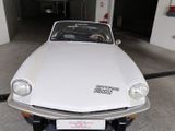 a white car that is parked in a garage