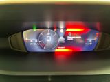 the dashboard of a car with a digital display on it