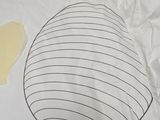 a paper bag with a drawing of an egg and a piece of butter on it