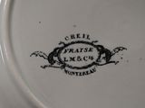 a close up of a plate with a bird on it