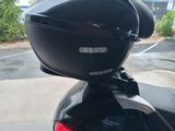 a close up of a motorcycle parked in a parking lot
