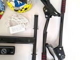 a helmet, a pair of pliers, and a pair of scissors on a table