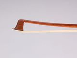 a close up of a violin bow on a white background
