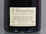 a bottle of wine that is sitting on a table