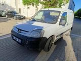 a white van that is parked on the side of the street