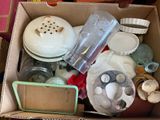 a cardboard box filled with assorted items on a table