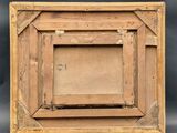 an old wooden picture frame with a picture in it