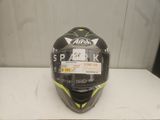 a close up of a helmet on a table with a sticker on it