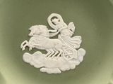 a white plate with a picture of a woman riding a horse