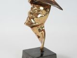 statue of a woman with a hat on her head on a marble base