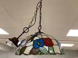 a lamp that is hanging from the ceiling in the room