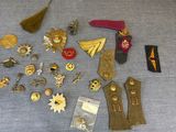 a table with a lot of pins and badges on it