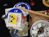 a bowl of candy and a baseball bat on a table