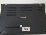 a close up of the bottom of a laptop with a sticker on it