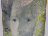 painting of a woman ' s face in a white frame with a yellow border