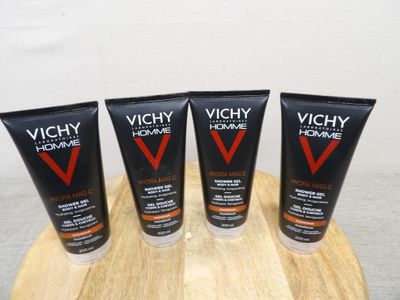 three tubes of vichyy men ' s shave cream on a wooden board