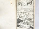 an open book with a map on it sitting on a table
