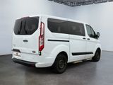 the white van is parked in the large room of the building