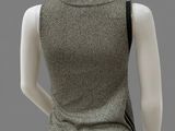 the back of a mannequin mannequin wearing a grey top and black pants