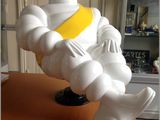 a statue of a man sitting on top of a table