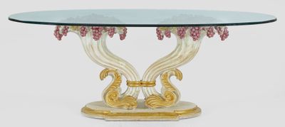 une photo d'une table en verre avec un piètement doré et un plateau en verre