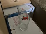 a glass of water sitting on top of a box