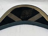 une image représentant un chapeau militaire orné d'une bande noire et beige